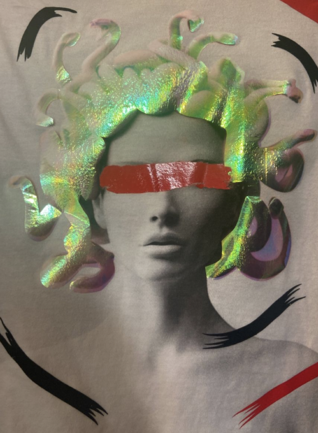 Graphic artwork of a statue-like face with iridescent snake hair and a red bar covering the eyes, surrounded by black and red brush strokes.