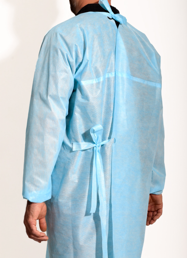 Person wearing a disposable light blue isolation gown seen from the back.
