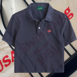 Navy Ralph Lauren polo shirt with a red USA Swimming 1981 logo in the background.