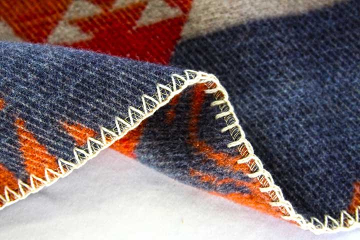 Blanket edge stitching with zigzag finish.
