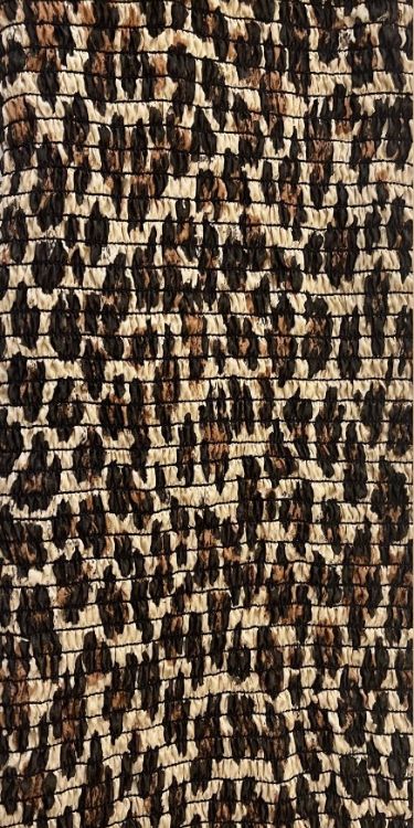 Tweed-like woven textile with black and tan flecks.