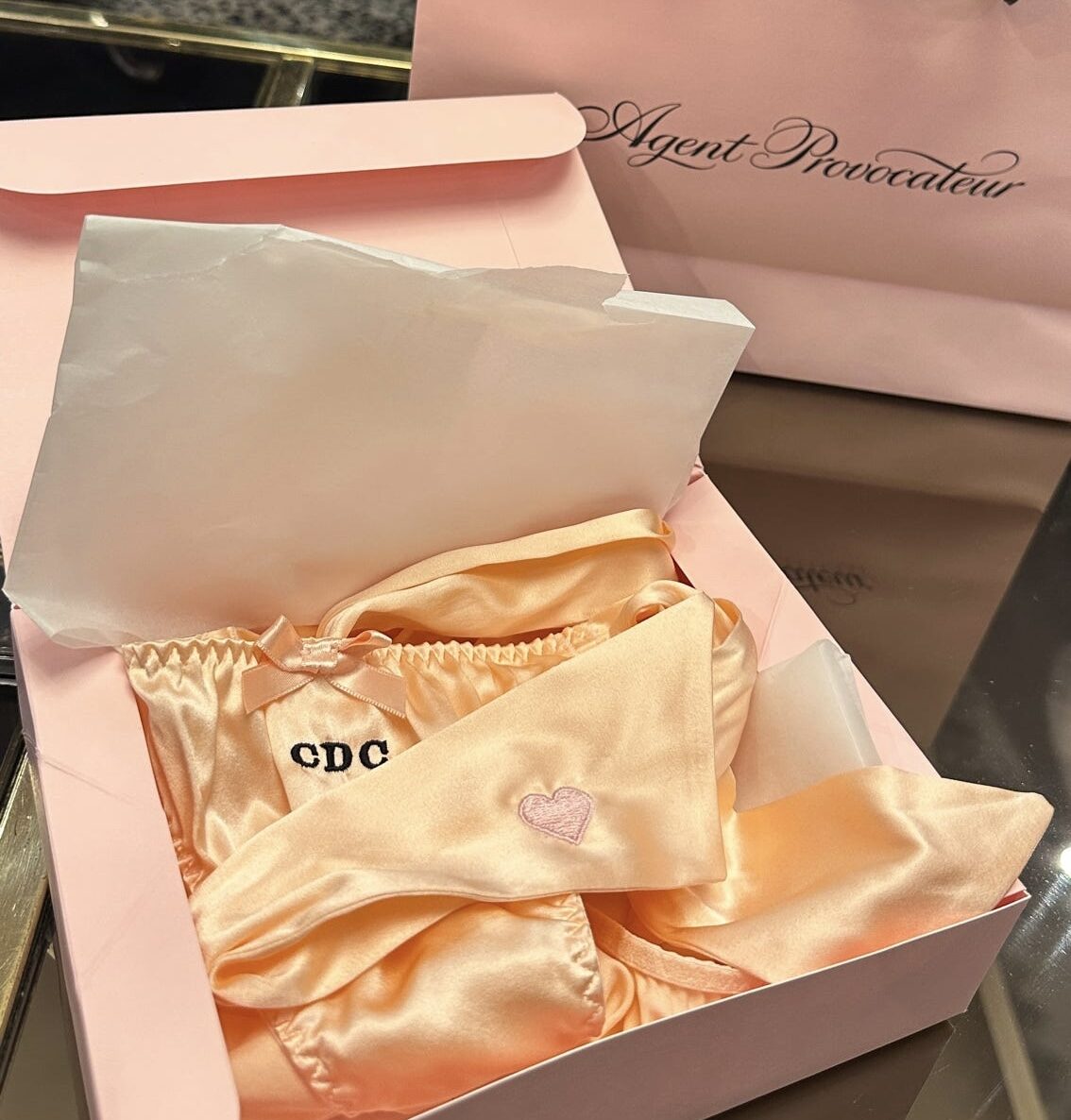 Live Embroidery with Agent Provocateur on silk pajamas, robes, and underwear