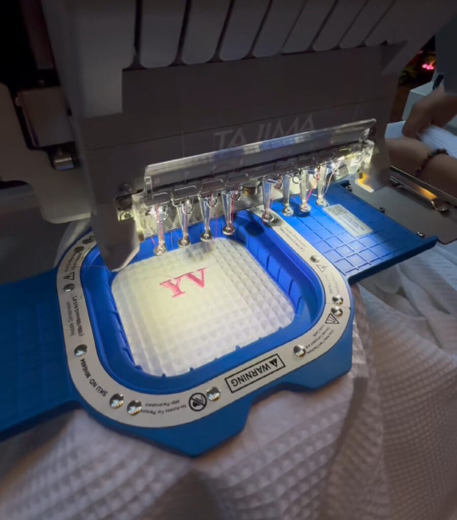 live embroidery in nyc adding initials to robes