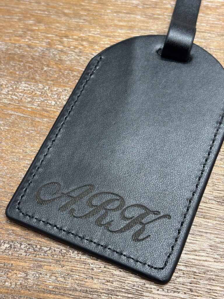 live laser engraving nyc for fora travel on black luggage tags
