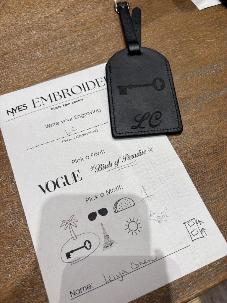 live laser engraving nyc for fora travel on black luggage tags