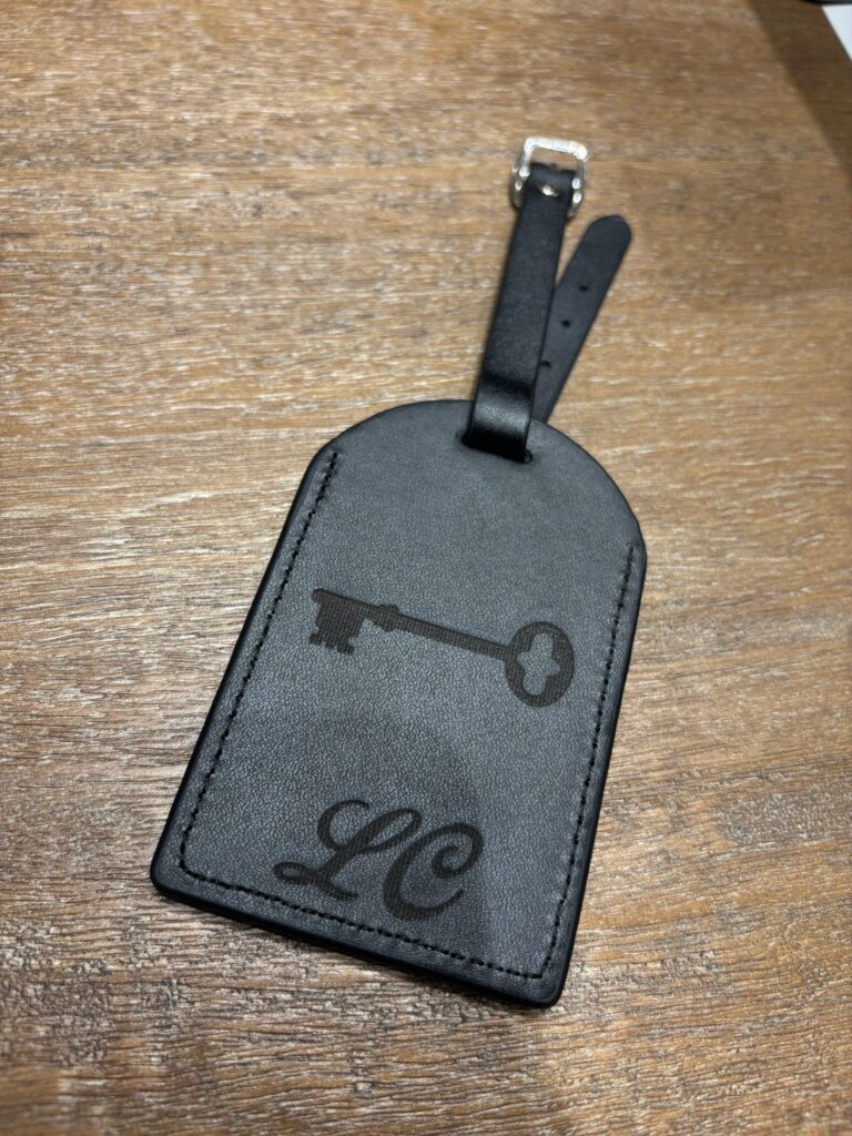 live laser engraving nyc for fora travel on black luggage tags