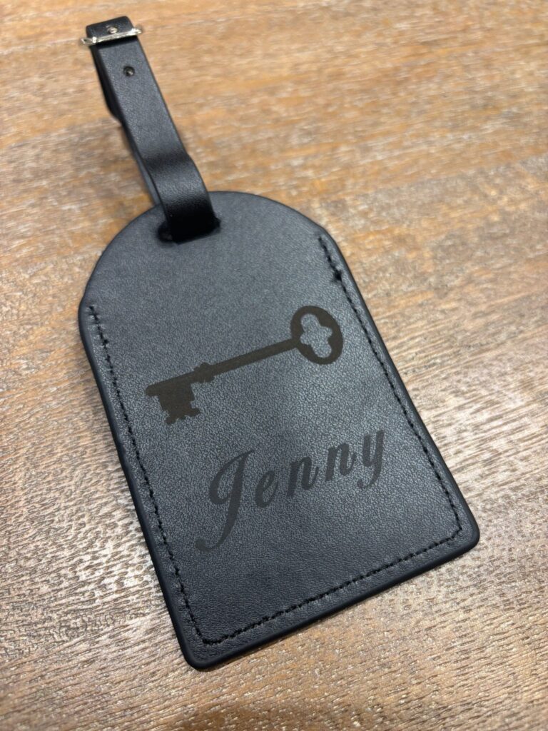 live laser engraving nyc for fora travel on black luggage tags