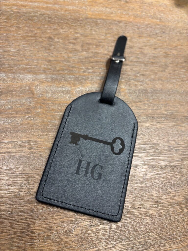live laser engraving nyc for fora travel on black luggage tags