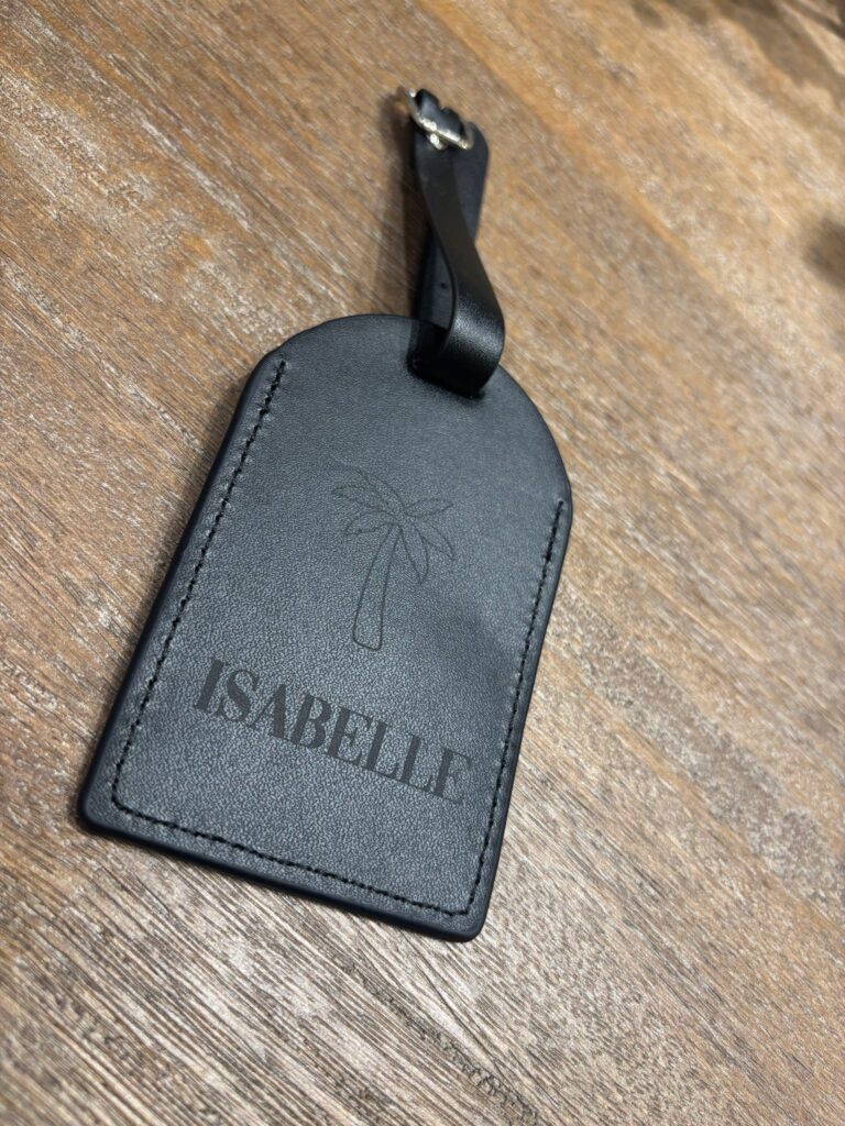 live laser engraving nyc for fora travel on black luggage tags