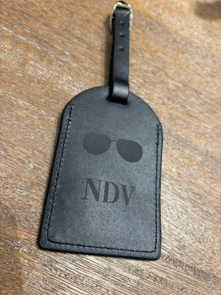 live laser engraving nyc for fora travel on black luggage tags