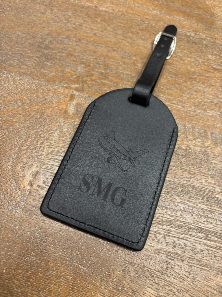 live laser engraving nyc for fora travel on black luggage tags
