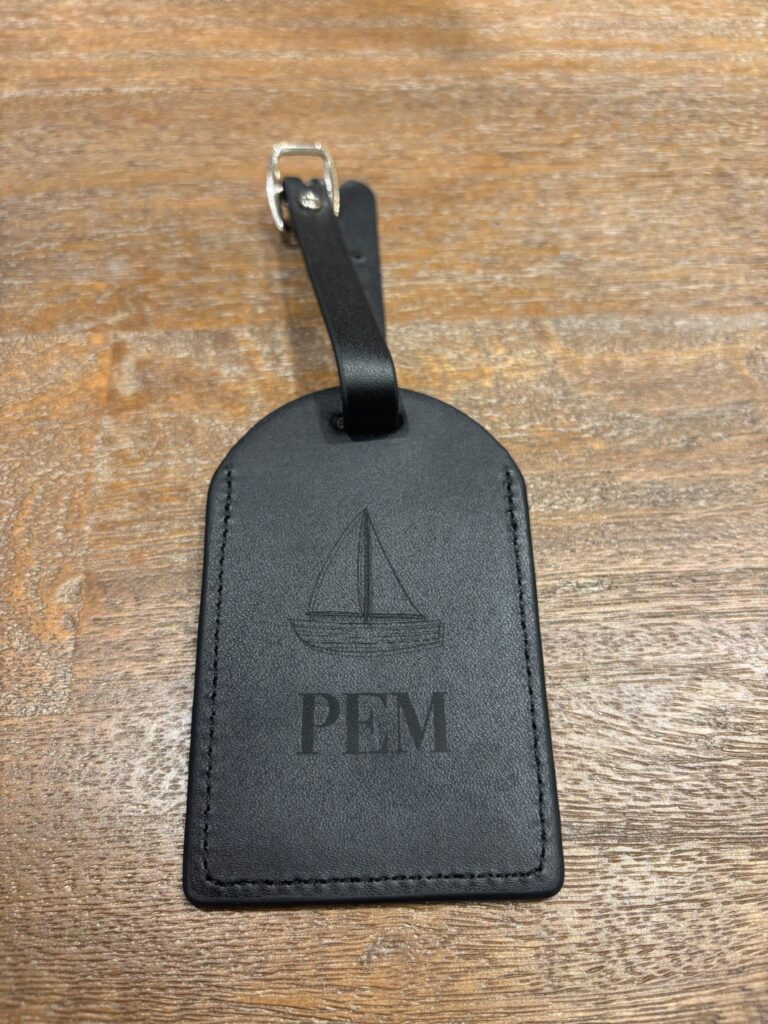 live laser engraving nyc for fora travel on black luggage tags