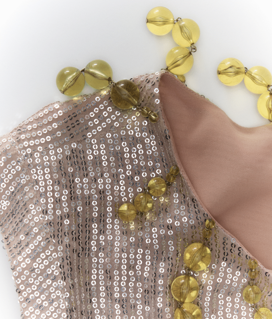 J.Crew reworked vintage garment, featuring added fur details for texture and intricate hand-applied beadwork for individuality.