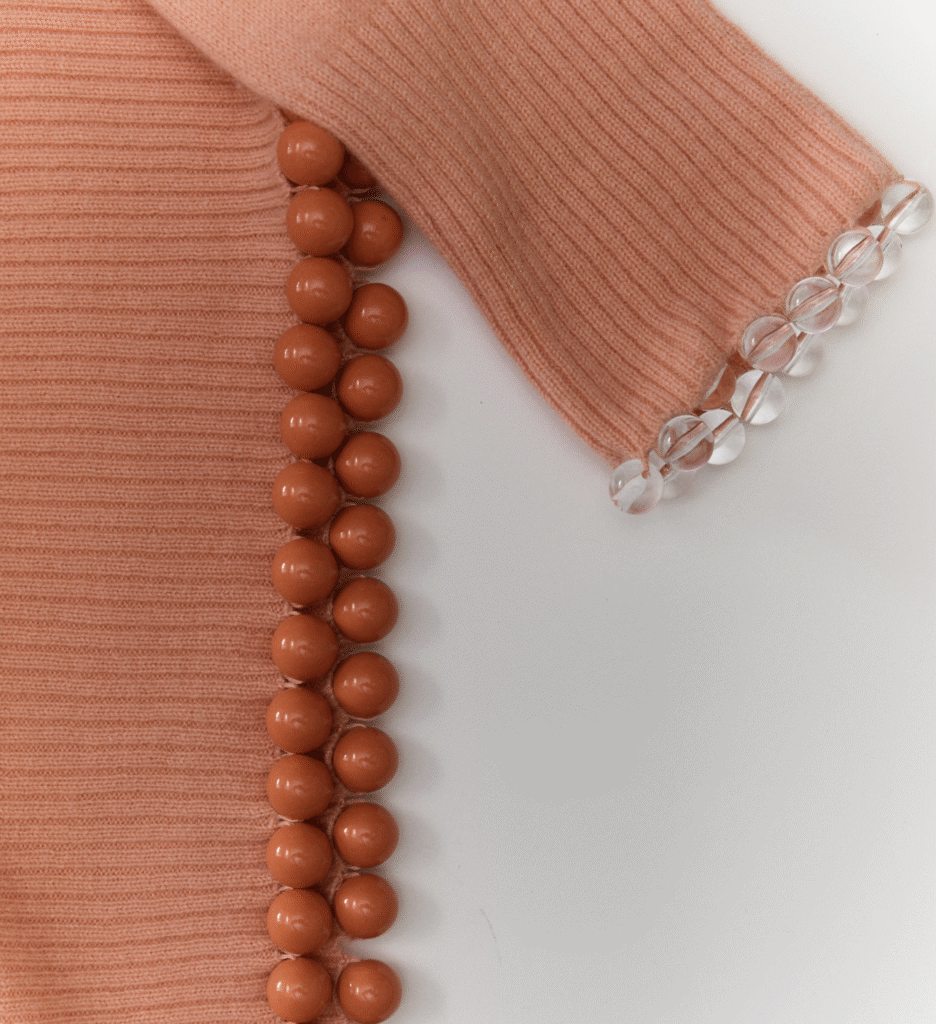 J.Crew reworked vintage garment, featuring added fur details for texture and intricate hand-applied beadwork for individuality.
