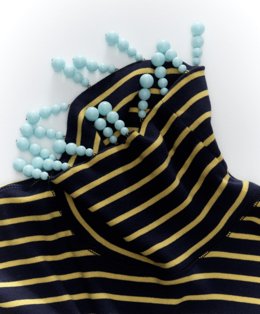 J.Crew reworked vintage garment, featuring added fur details for texture and intricate hand-applied beadwork for individuality.