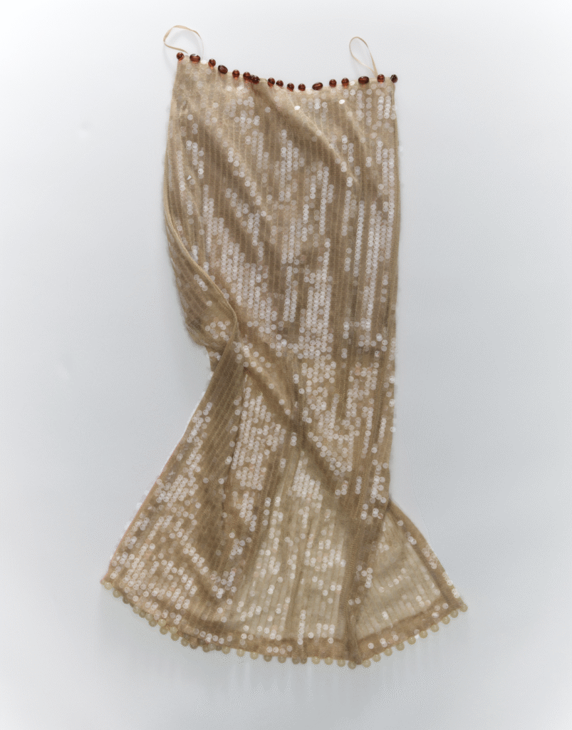 J.Crew reworked vintage garment, featuring added fur details for texture and intricate hand-applied beadwork for individuality.