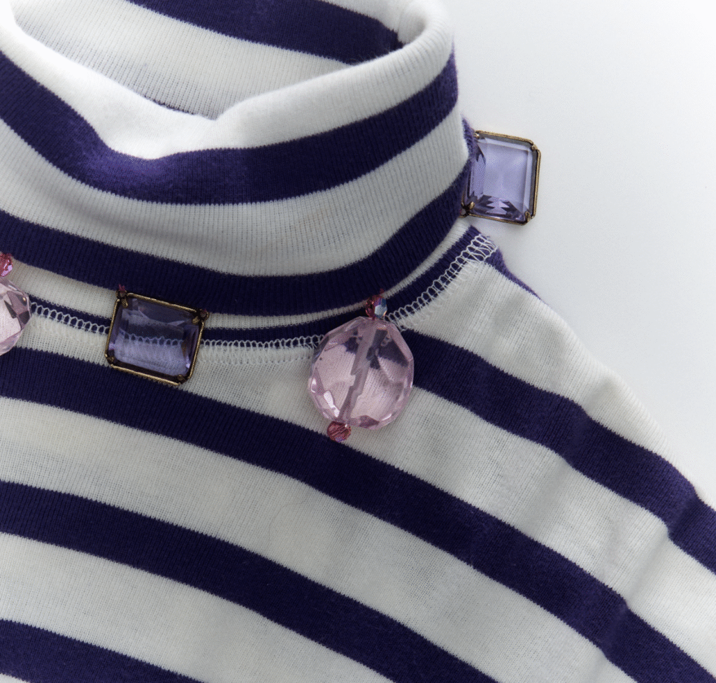J.Crew reworked vintage garment, featuring added fur details for texture and intricate hand-applied beadwork for individuality.