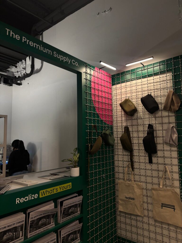 Guests having their Dagne Dover pouches custom embroidered live at the Taboola event.