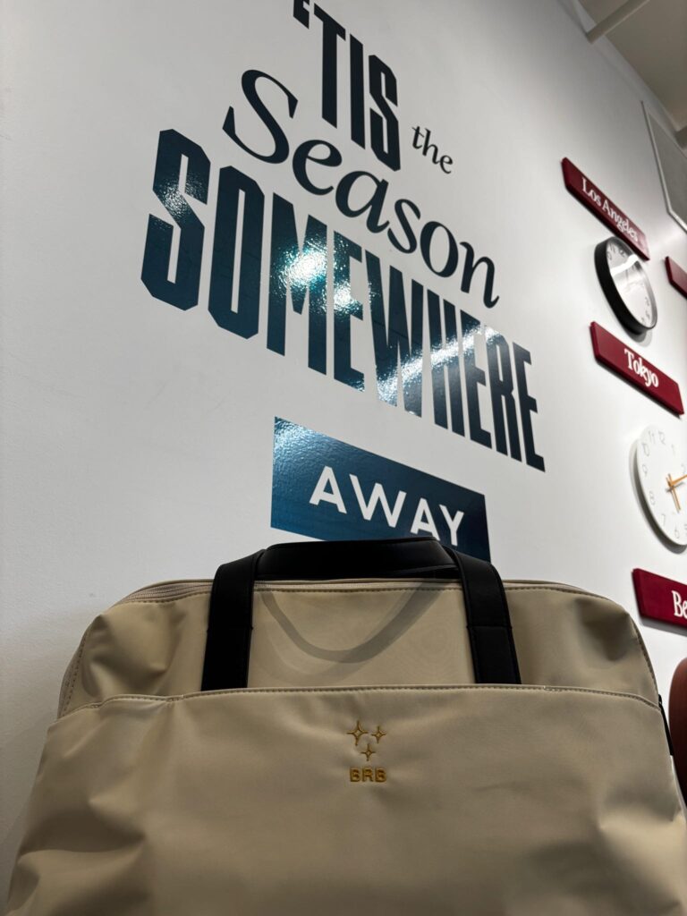 Beige AWAY travel tote embroidered with gold stars and “BRB” lettering by New York Embroidery Studio at the Winter Workshop event.
