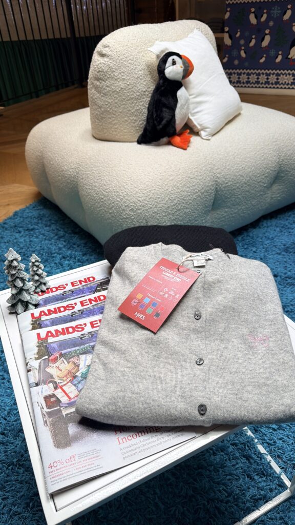 Embroidery samples showing NYES’s custom font options, thread color selections, and stitched holiday motifs, including a penguin, bow, Christmas tree, taxi, bear, and star—displayed in hoops for Lands’ End’s Chaotically Customized Holiday Shop