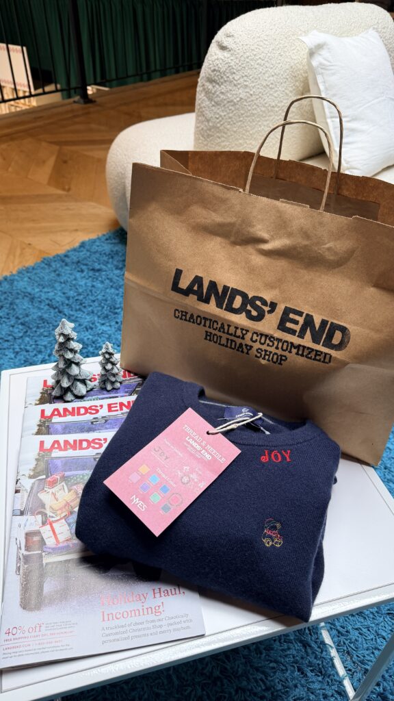 Embroidery samples showing NYES’s custom font options, thread color selections, and stitched holiday motifs, including a penguin, bow, Christmas tree, taxi, bear, and star—displayed in hoops for Lands’ End’s Chaotically Customized Holiday Shop