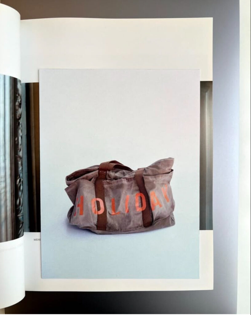 Brown duffle bag featuring Holiday graphic branding