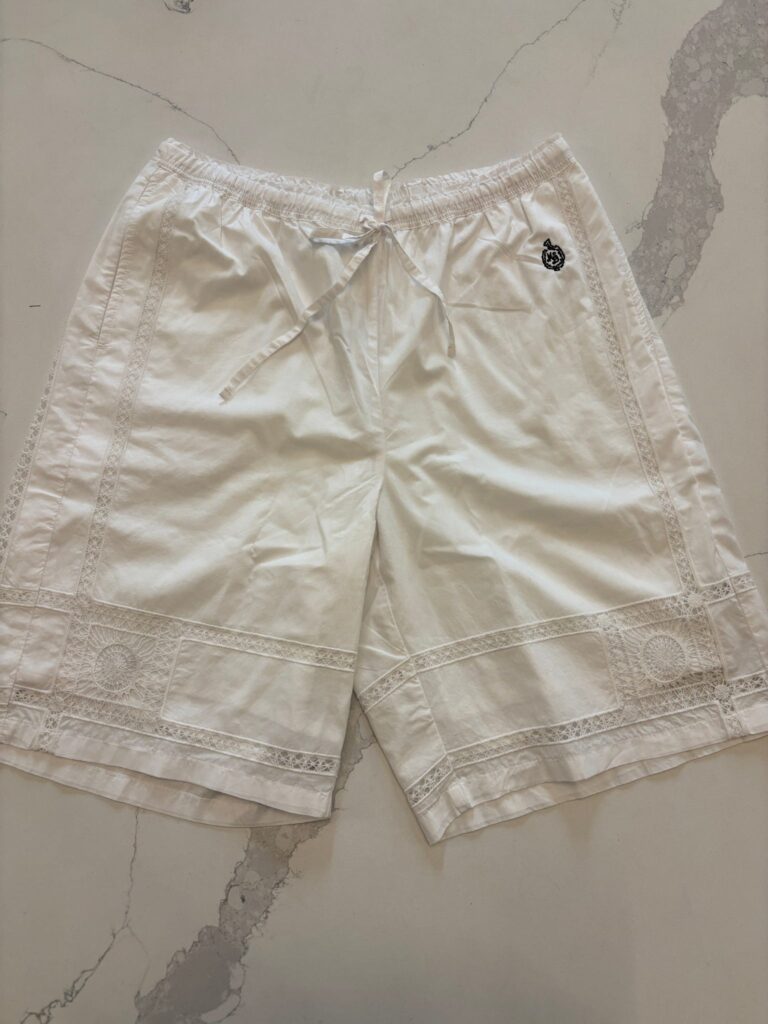 White shorts featuring lace trim and embroidered J.Crew patch detail