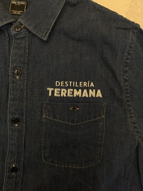 Close-up of Destilería Teremana logo embroidery above denim chest pocket