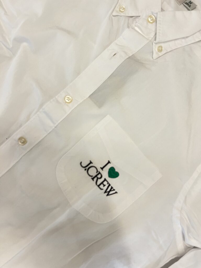 I Love J.Crew embroidery stitched in white thread on shirt chest pocket area