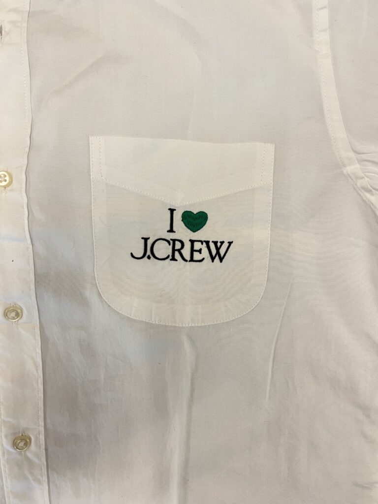 I Love J.Crew embroidery stitched in white thread on shirt chest pocket area