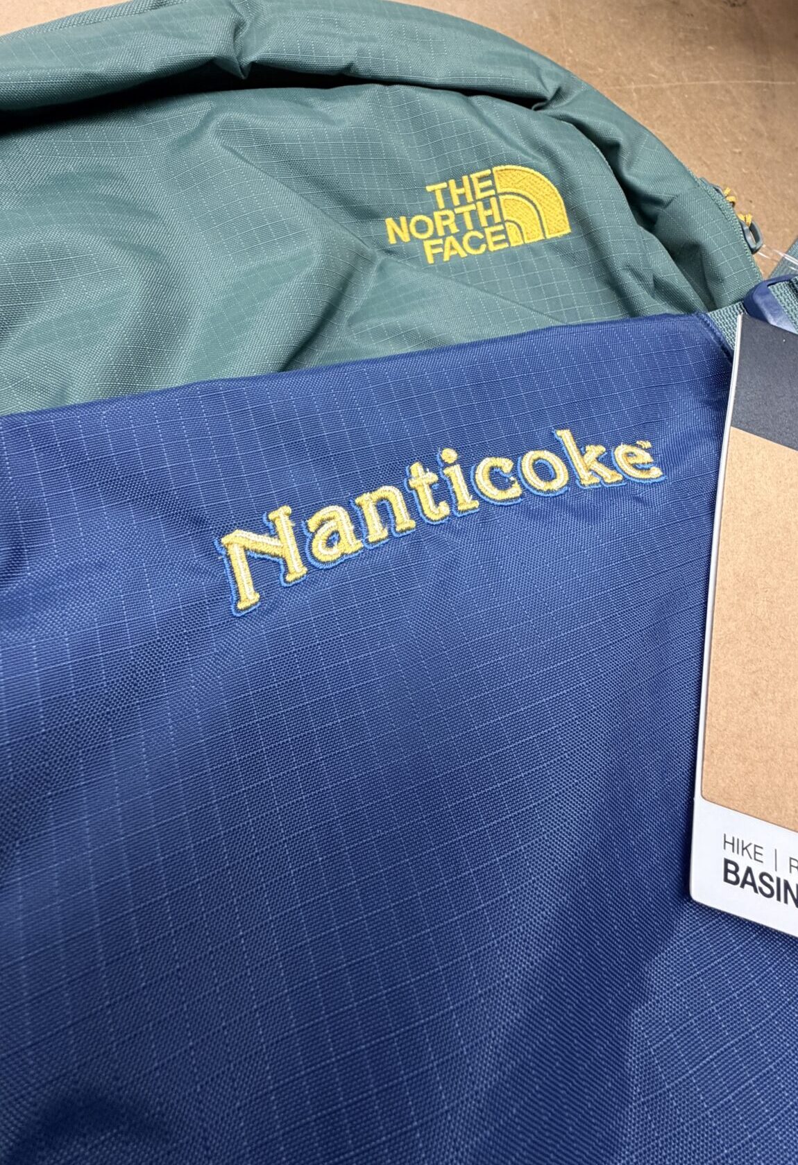 Close-up of custom digital embroidery reading “Nanticoke” on ripstop backpack fabric