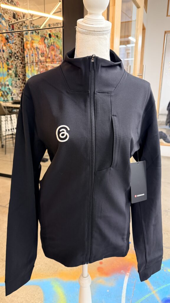 Threads logo applied with custom performance apparel embroidery onto Lululemon base jackets.