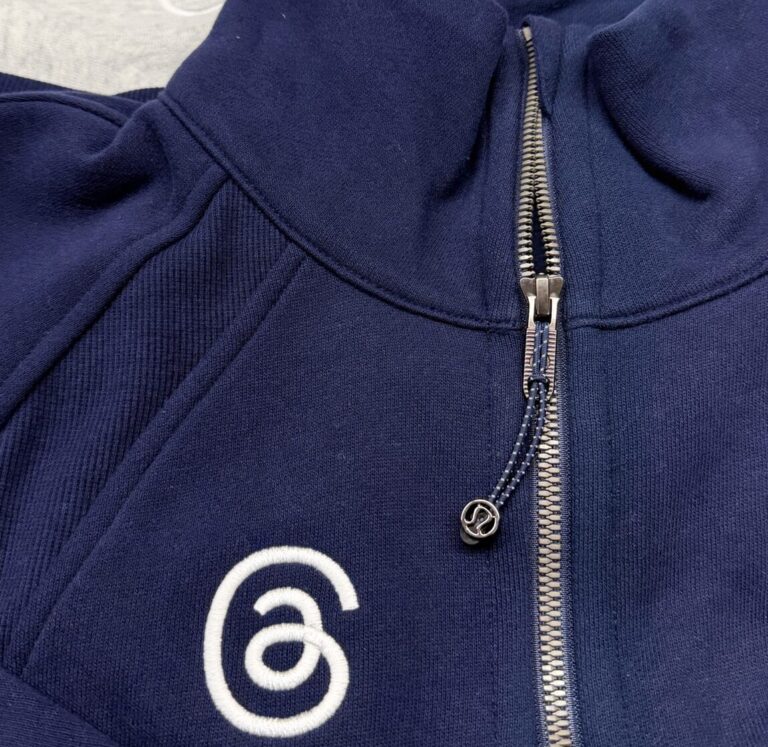 Threads logo applied with custom performance apparel embroidery onto Lululemon base jackets.
