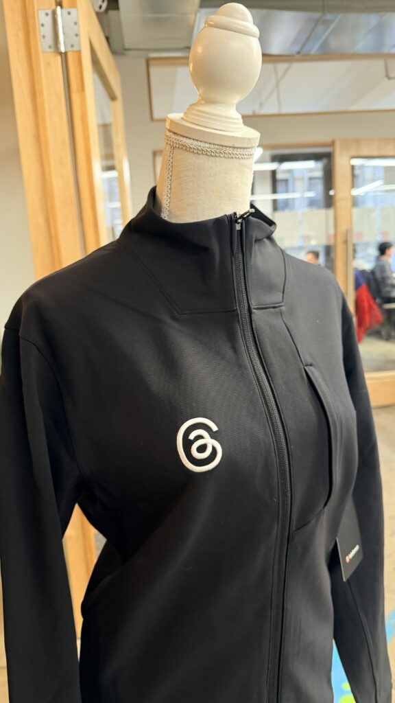 Threads logo applied with custom performance apparel embroidery onto Lululemon base jackets.