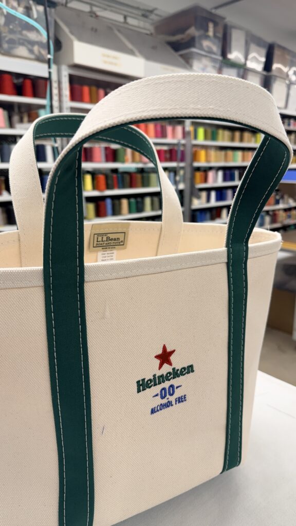 Custom embroidered Heineken 0.0 logo on canvas L.L.Bean Boat and Tote bag produced by New York Embroidery Studio