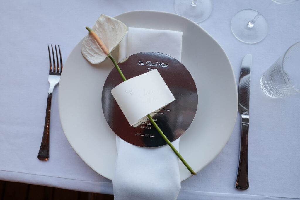 Custom embroidered linen napkins with calligraphy menu and place card at Intimissimi Ultralight Cotton Collection event in Los Angeles