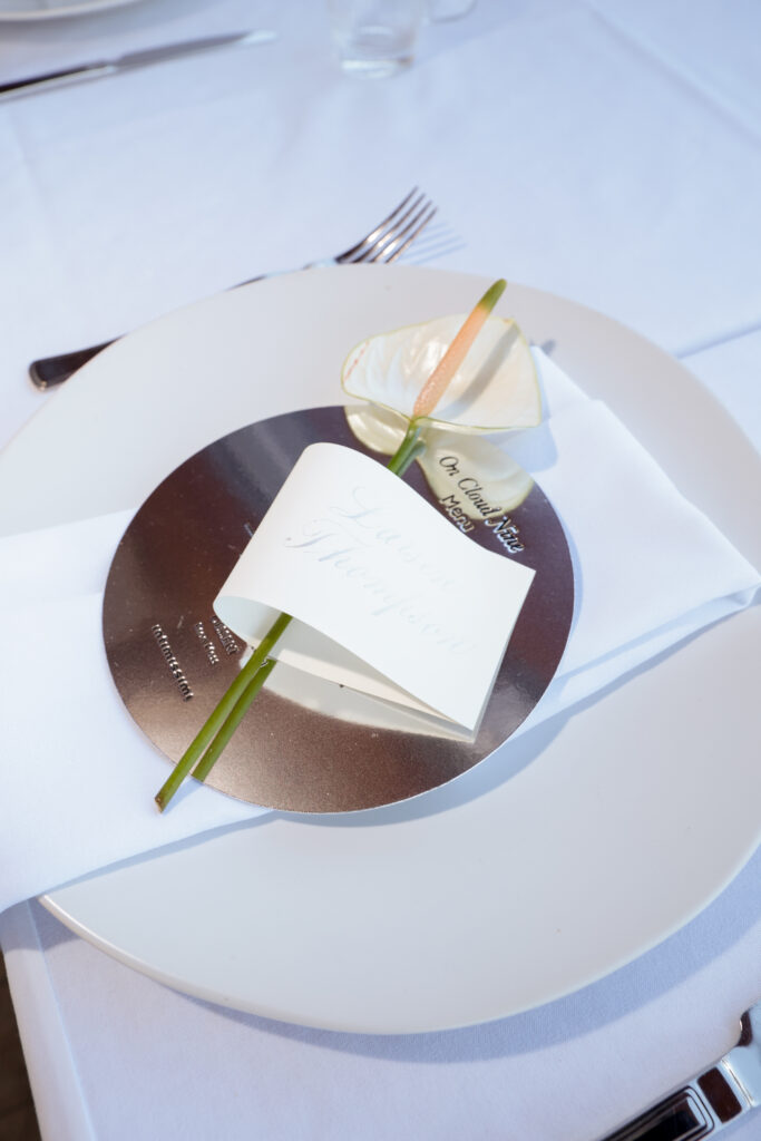 Custom embroidered linen napkins with calligraphy menu and place card at Intimissimi Ultralight Cotton Collection event in Los Angeles