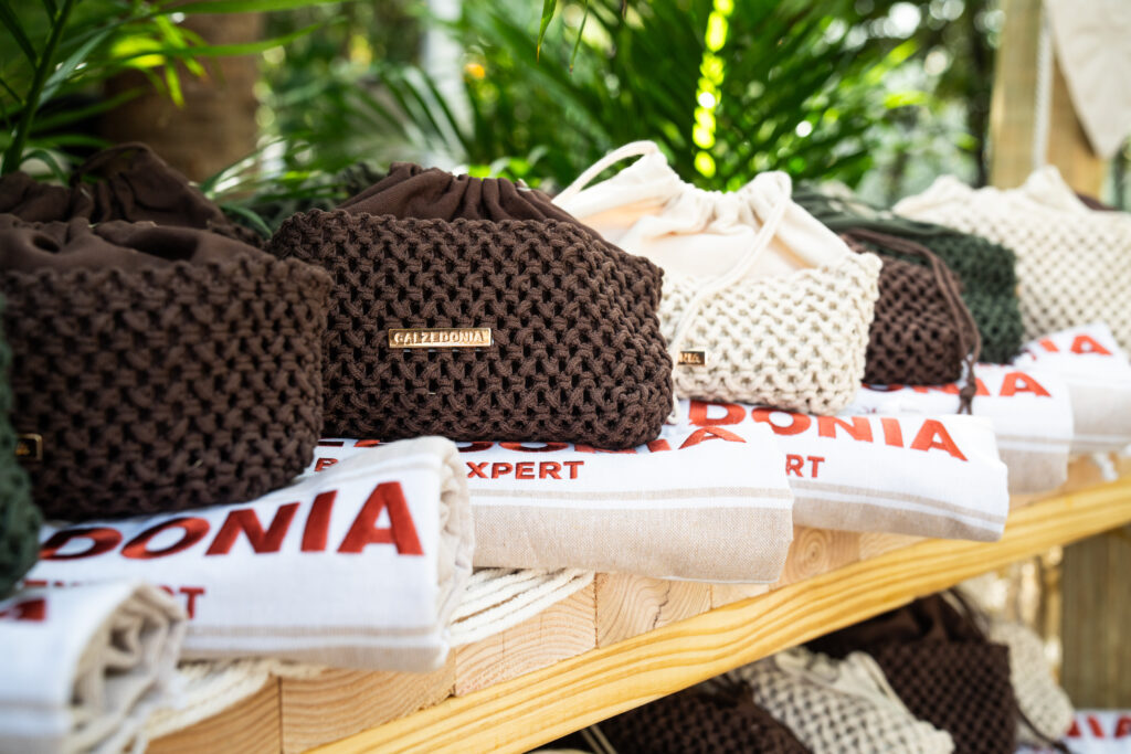 Custom embroidered Calzedonia towels displayed at Soho Beach House Miami event