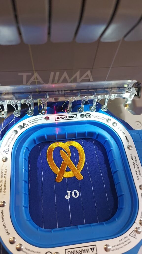 ive embroidery customization at Auntie Anne’s event with personalized garments