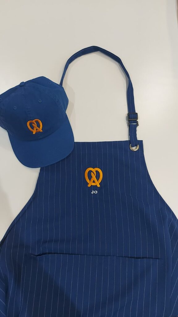 live embroidery customization at Auntie Anne’s event with personalized garments
