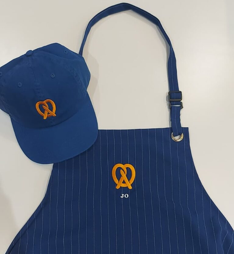 live embroidery customization at Auntie Anne’s event with personalized garments