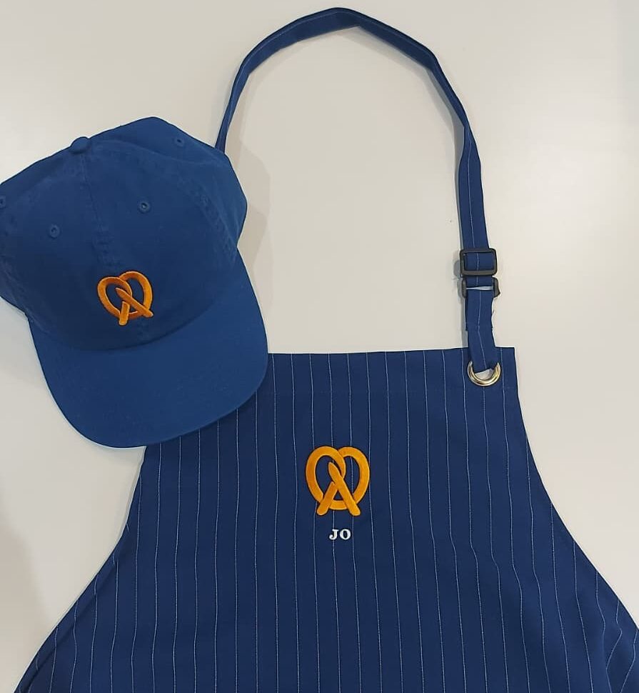 live embroidery customization at Auntie Anne’s event with personalized garments