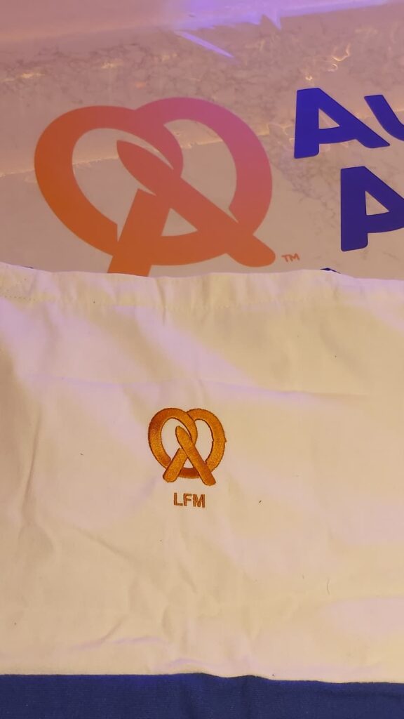 ive embroidery customization at Auntie Anne’s event with personalized garments