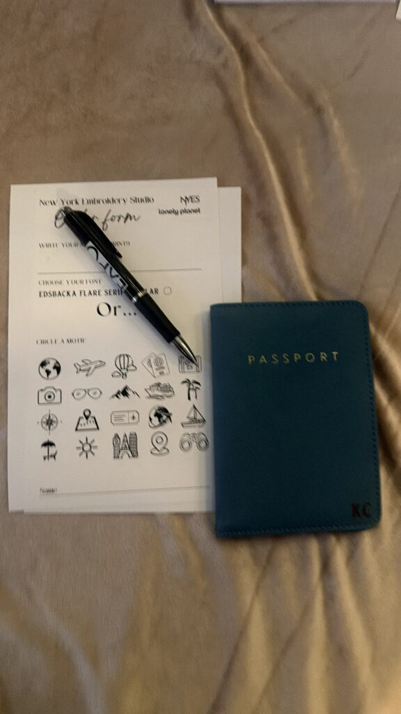 NYES live laser engraving station personalizing leather passport covers for guests
