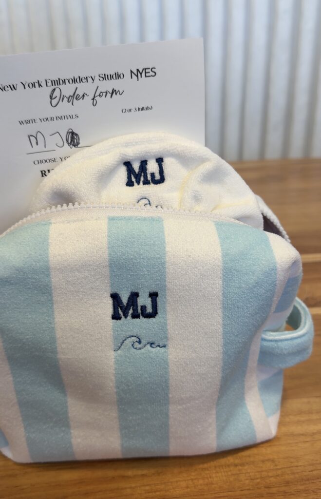 Detailed embroidery craftsmanship on personalized travel pouches