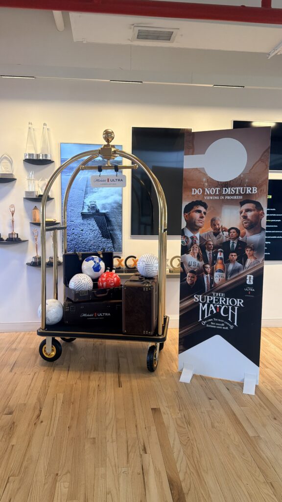 NYES live customization station featuring vinyl hat transfers