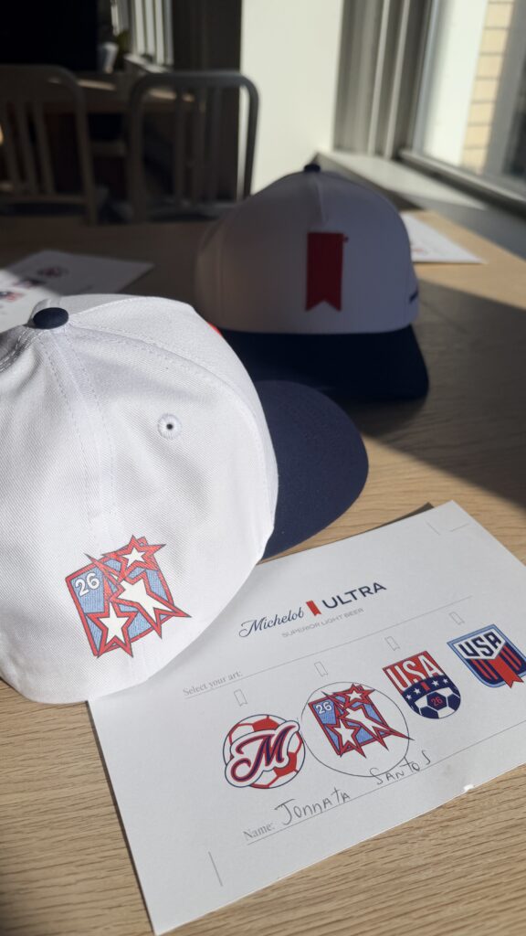 NYES live customization station featuring vinyl hat transfers