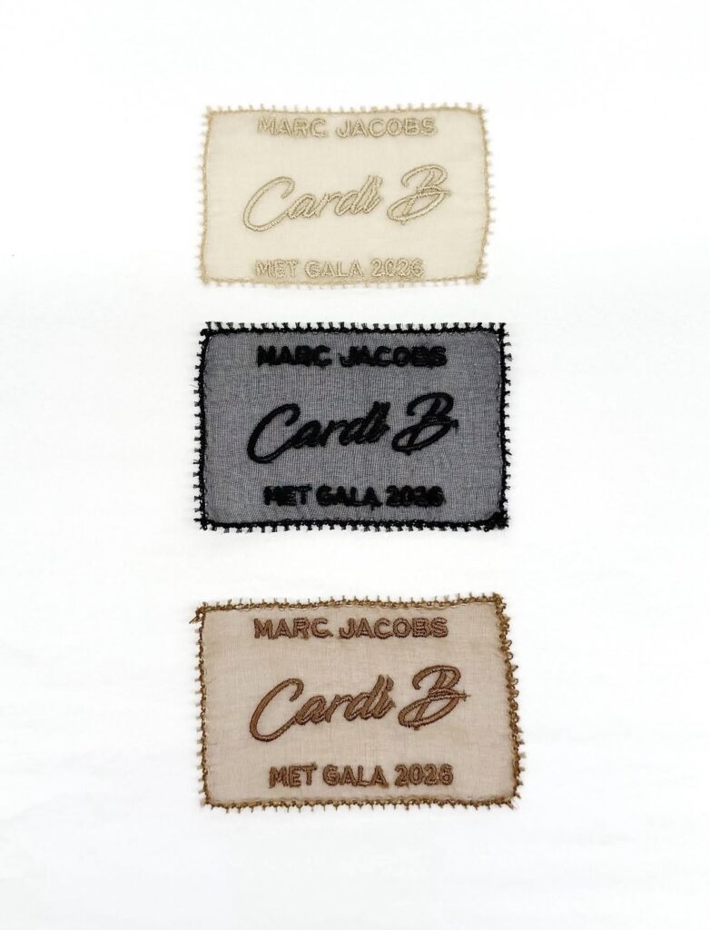 Close-up of custom embroidered fashion label created for a Met Gala 2026 garment