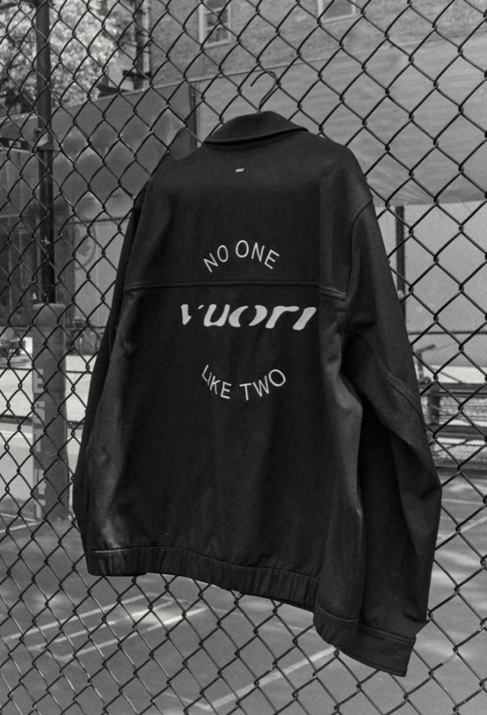 A custom embroidered championship jacket created for Miles McBride in partnership with Vuori Clothing.