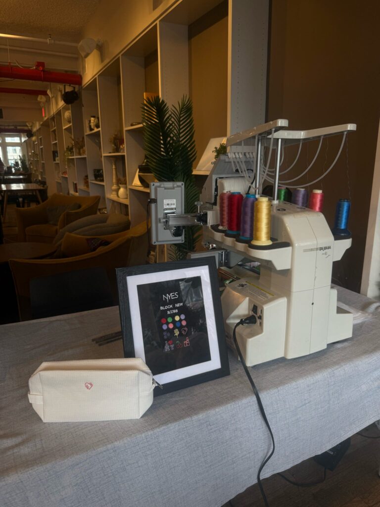 On-site embroidery station created by NYES for a TikTok Shop beauty experience.